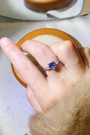 Sterling silver ring with blue heart sapphire and baguette accents