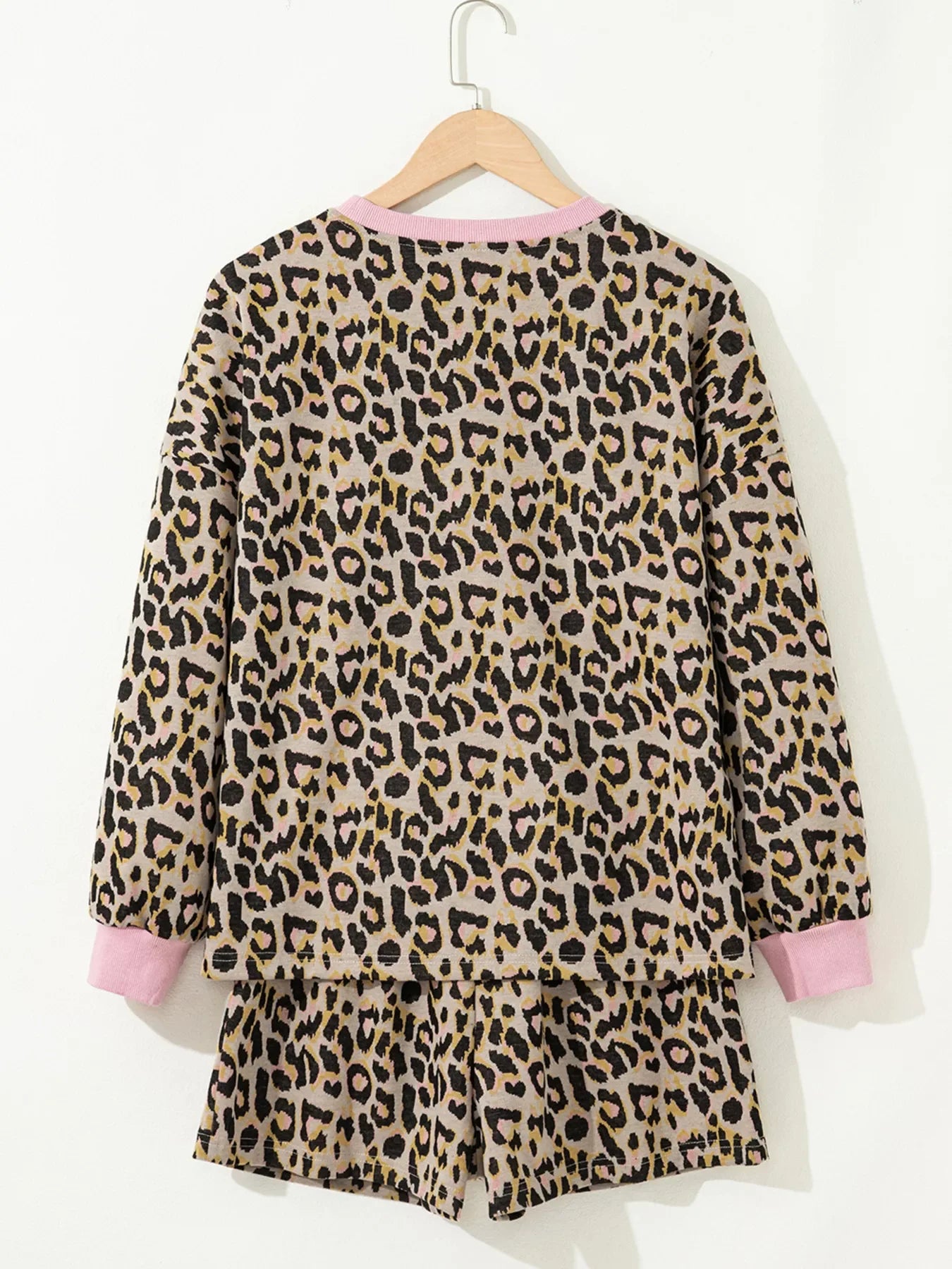 Leopard print loungewear set with pink trim on crew neck and cuffs.