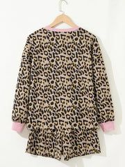 Leopard print loungewear set with pink trim on crew neck and cuffs.
