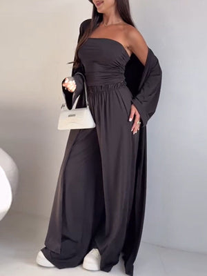 Black three-piece outfit set with ruched strapless top, wide-leg pants, and open cardigan.