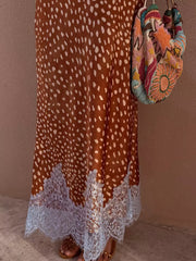 Brown polka dot skirt with white lace trim, styled with a beaded bag.