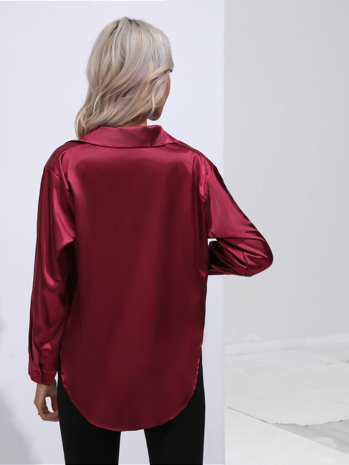 Burgundy satin tie-front blouse with a collared neckline and long sleeves.