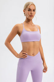 Lilac sports bra with crisscross back detail and scoop neckline.
