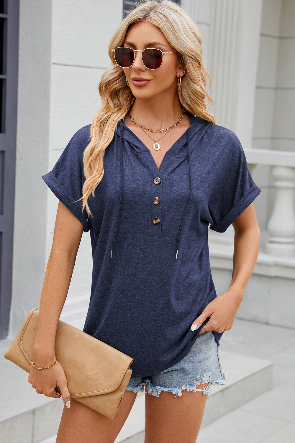 Navy blue Henley hooded tee with rolled short sleeves and a buttoned placket.
