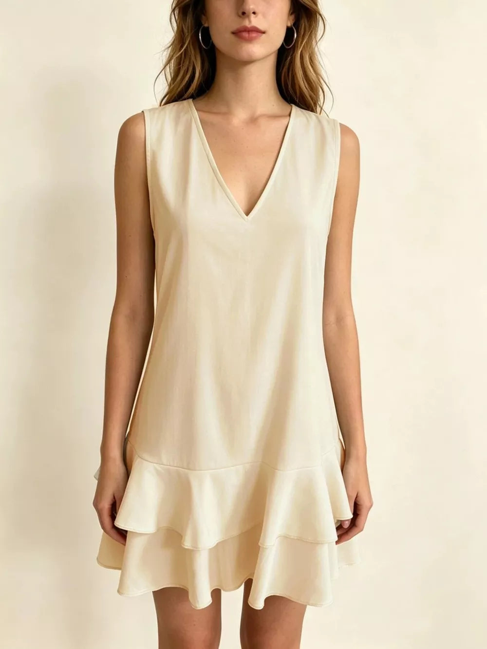 Tiered ruffle mini dress in Lotus Color with V-neck and sleeveless design.