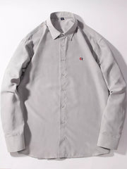 Light gray button-up shirt with red embroidered logo detail