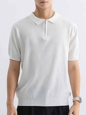 White textured knit zip-up polo shirt with short sleeves and a spread collar.