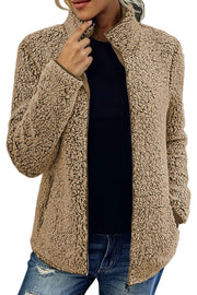 Camel teddy fleece zip-up jacket with a stand-up collar and full zip closure.