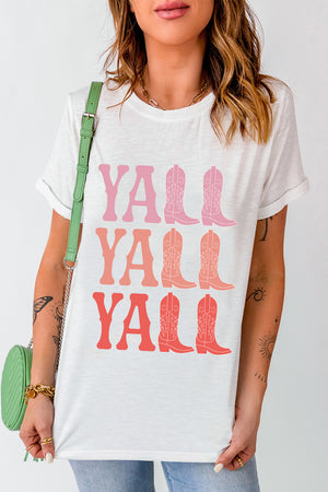 White graphic tee with "Y'all Boots" in pink and coral ombre text and cowboy boot graphics.