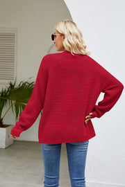 Red waffle knit raglan sleeve cardigan with ribbed cuffs and hem