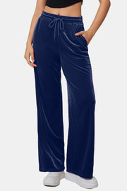 Navy velvet palazzo lounge trousers with drawstring waist and pockets.