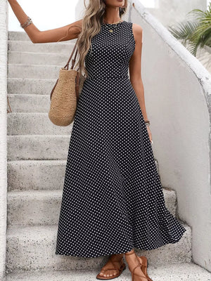 Black polka dot maxi dress with a flattering silhouette and sleeveless design.