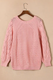 Dusty pink hollow-out knit sweater with puffy sleeves and diamond pattern detail.
