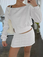 White cropped boat neck sweatshirt and drawstring mini skirt set