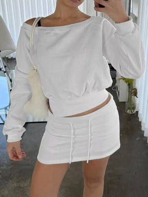 White cropped boat neck sweatshirt and drawstring mini skirt set