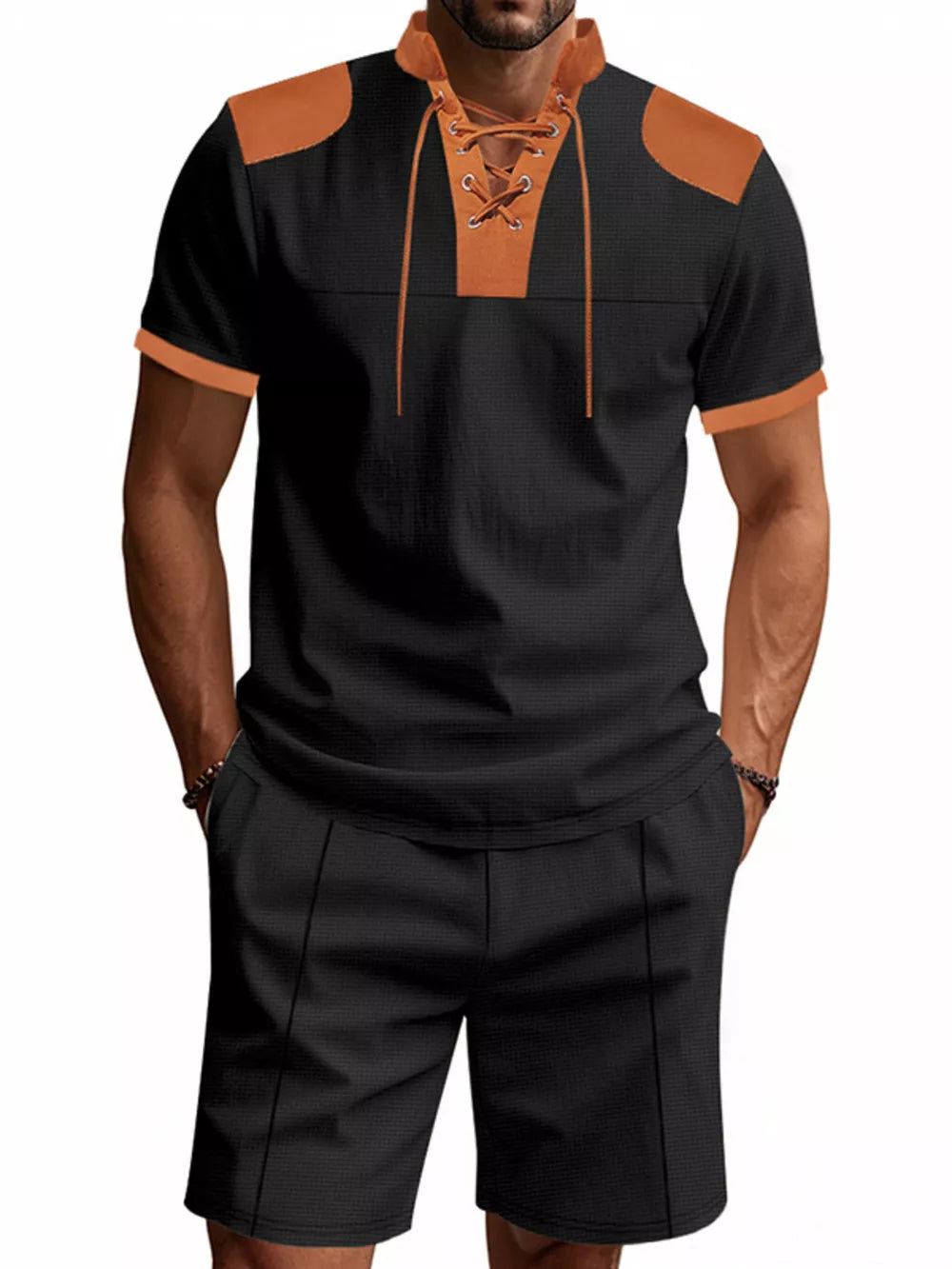 Black casual two-piece set with lace-up detail and contrasting tan accents.
