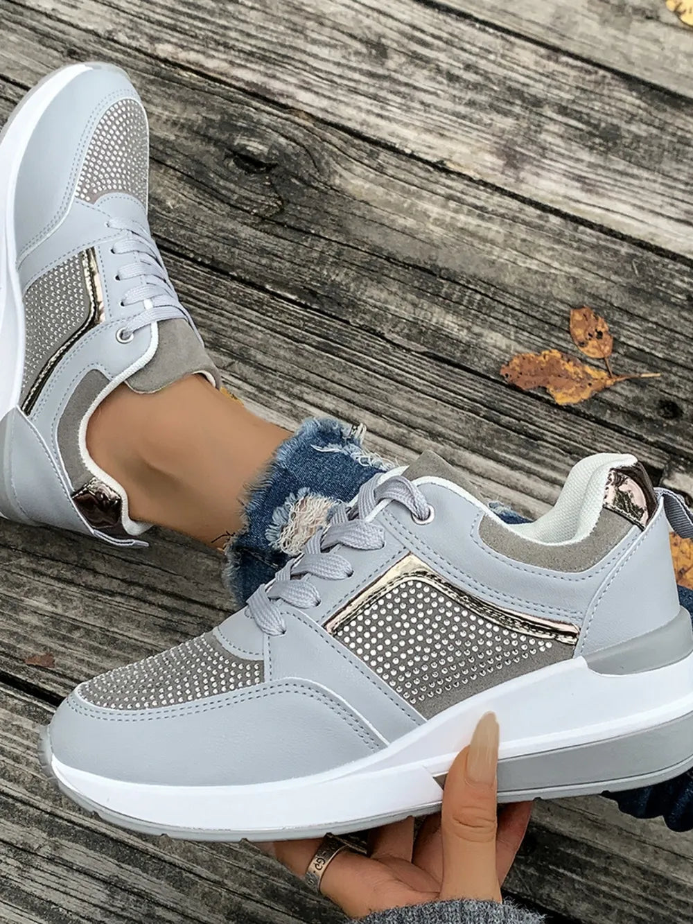 Light gray platform sneakers with gemstone panel details and white soles.