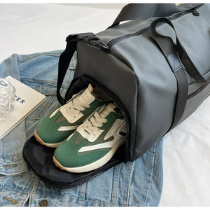 Dark Gray duffel bag with contrast straps, showing a shoe compartment with green and white sneakers.