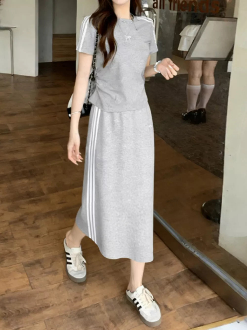 Gray striped tee and midi skirt set with side stripe detail.