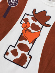Baby bodysuit with cow print number 1, cowboy hat and orange bandana graphic.