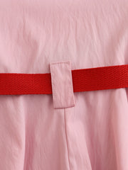 Pink cotton blend baseball dress for kids with red adjustable belt detail.