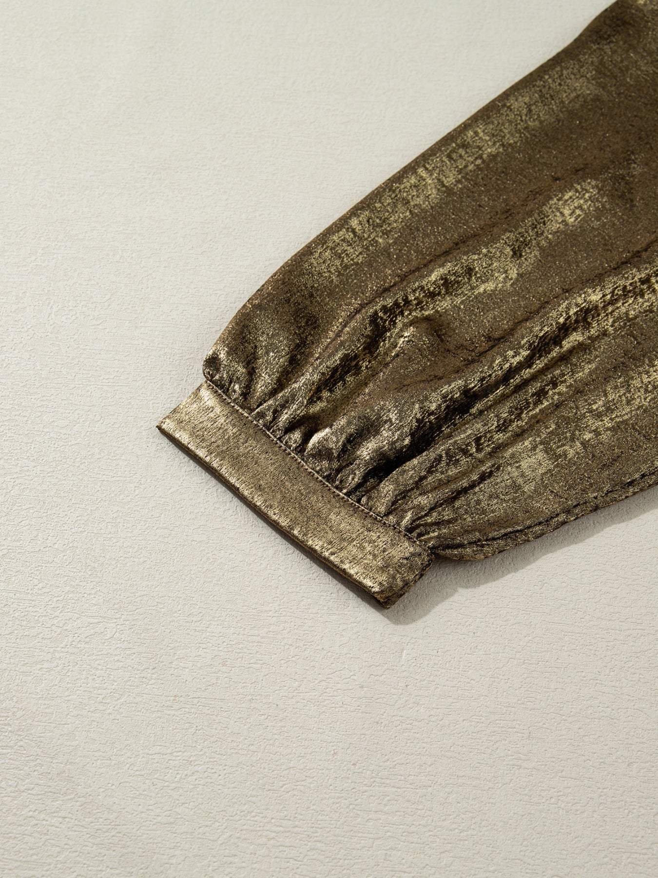 Textured gold blouse with 3/4 sleeves and a crinkled finish.