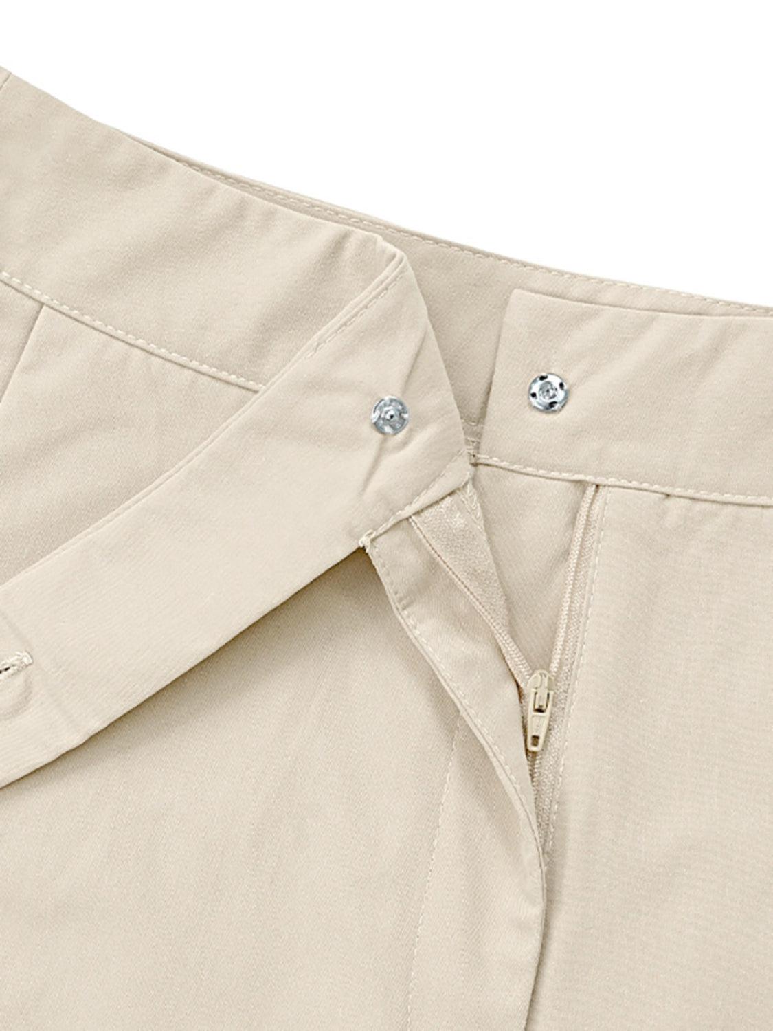 Beige tailored trousers with snap closure and zipper detail