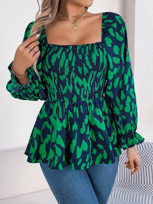 Smocked bodice print square neck blouse with long sleeves and ruffled cuffs in dark green and navy.