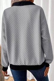Gray diamond quilted polo sweatshirt with black collar and hem