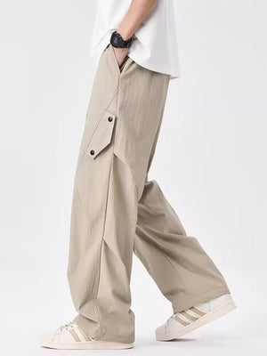 Light Apricot relaxed fit cargo sweatpants with button pockets and a loose cut.