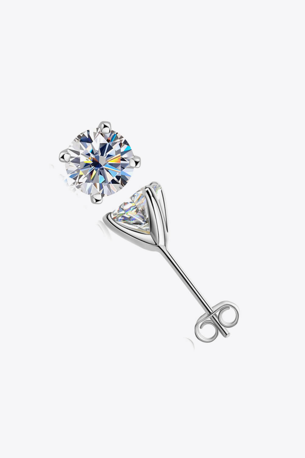 Silver moissanite solitaire stud earrings with sculpted setting and butterfly backs.