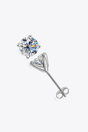 Silver moissanite solitaire stud earrings with sculpted setting and butterfly backs.