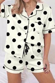 Cream polka dot button-up pajama set with black trim and chest pocket.