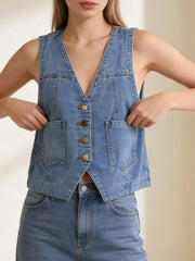 Light blue denim button-down vest with brass buttons and cropped length