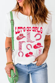 White graphic t-shirt with "Let's Go Girls" text and western icons like cowboy boots and hats.