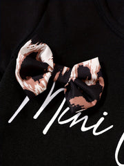 Black baby tee with leopard print bow accent and white script text