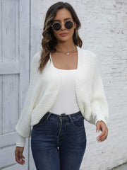 Women's white acrylic batwing sleeve cardigan with ribbed texture and open front.