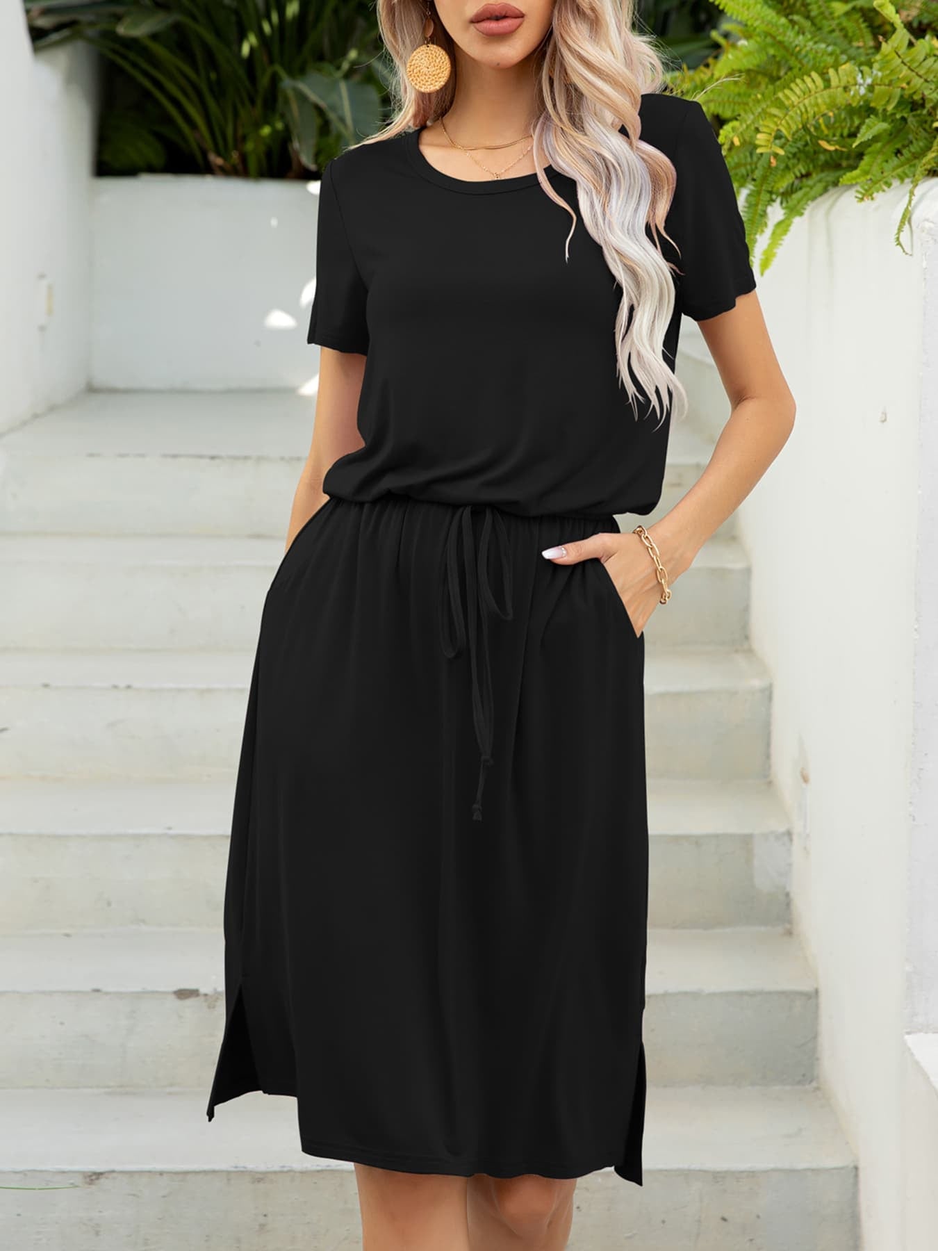 Black midi dress with drawstring waist, short sleeves, and side slits.