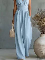 Sky blue sleeveless wide-leg jumpsuit with cinched waist and pockets