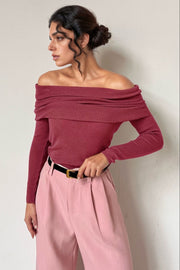 Off-the-shoulder ribbed knit top in Deep Rose with draped neckline.