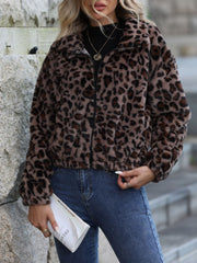 Leopard print zip-up jacket with a fuzzy texture and collar.