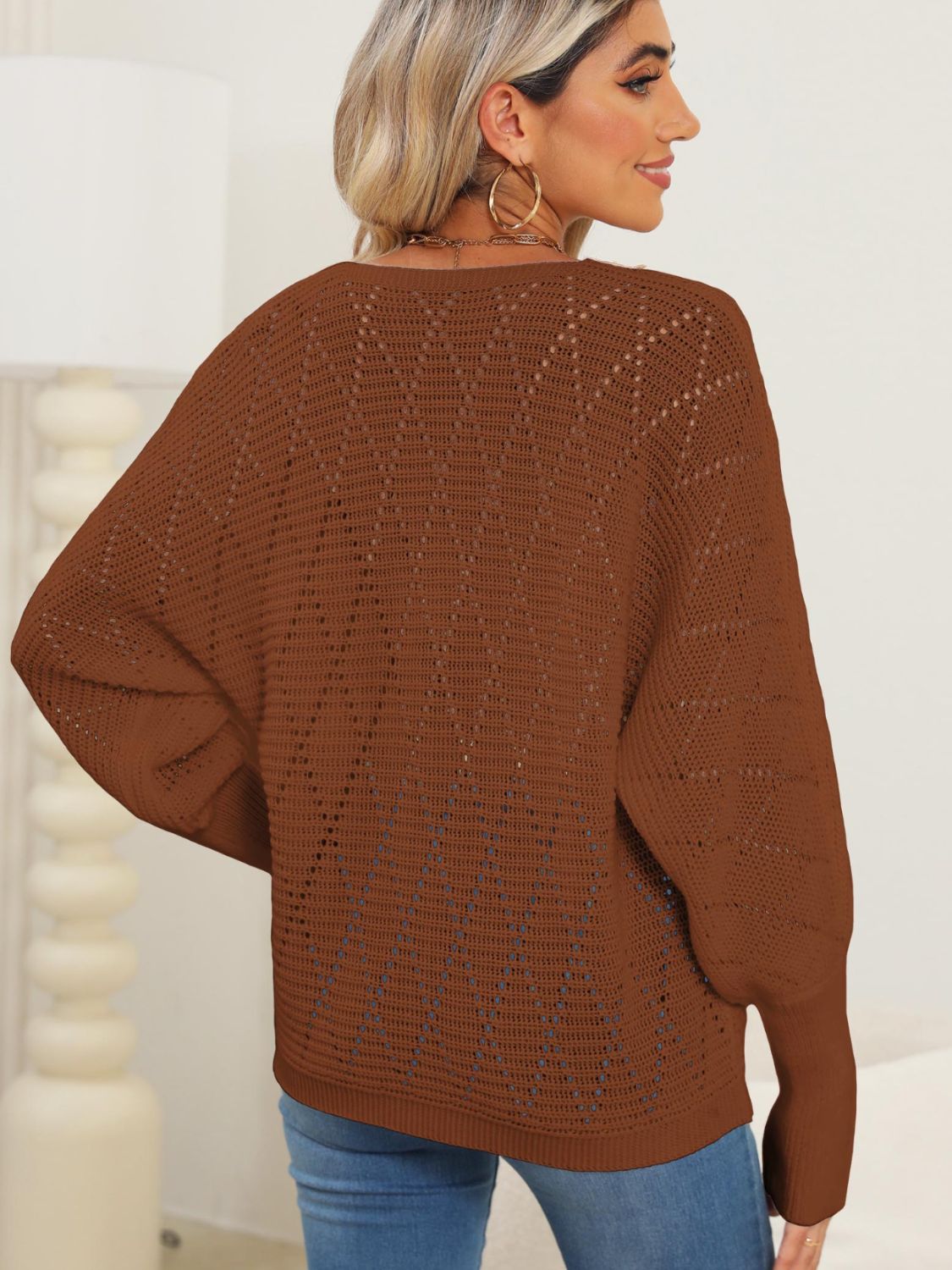 Brown openwork dolman sweater with lace trim detail, 100% acrylic.