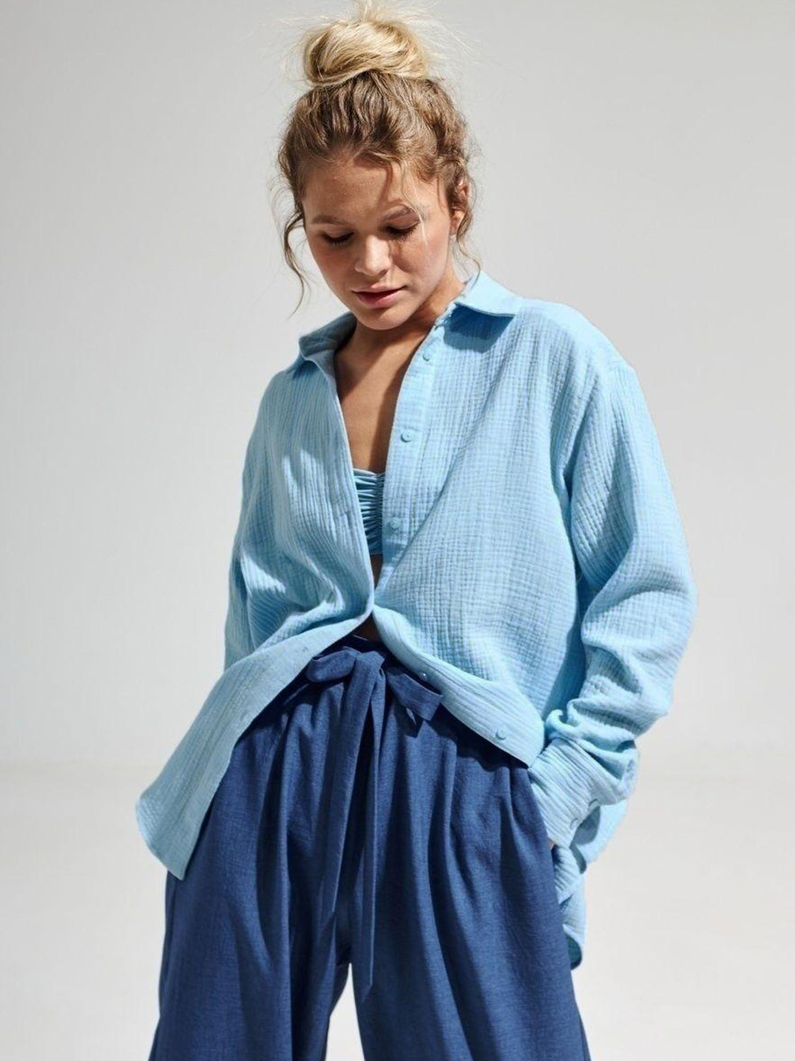 Light blue textured cotton overshirt with relaxed fit and button front.