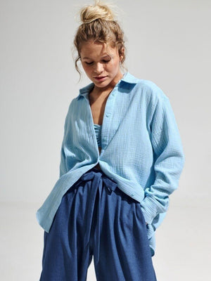 Light blue textured cotton overshirt with relaxed fit and button front.