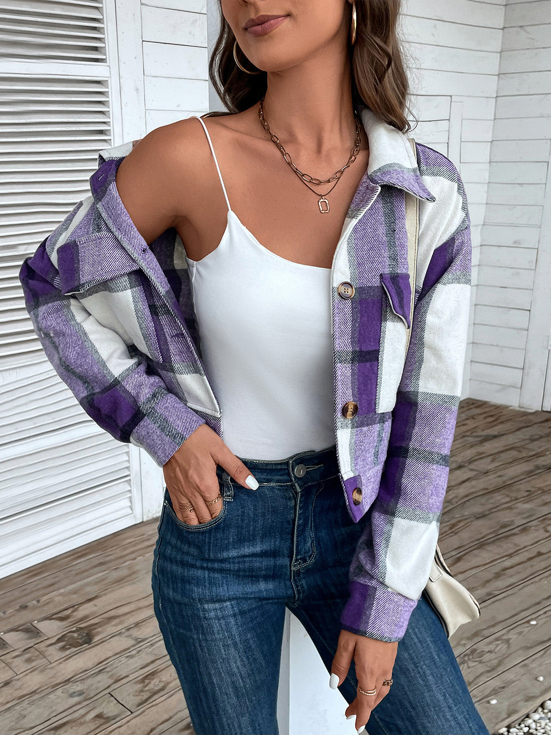 Checked plaid shacket in purple and white with button closure and patch pockets.