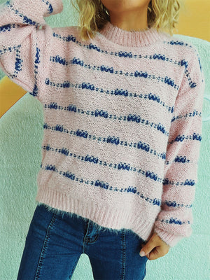 Blush pink crew neck sweater with textured blue stripes and fuzzy acrylic knit.