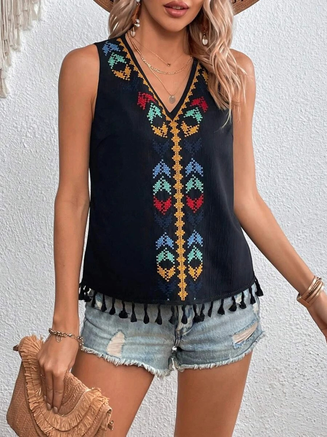 Black embroidered V-neck tank top with tassels and colorful bohemian pattern.