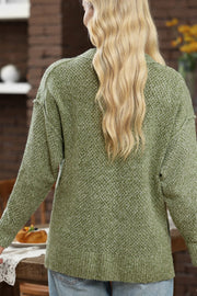 Open-knit slouchy V-neck sweater in matcha green with long sleeves and a relaxed fit.