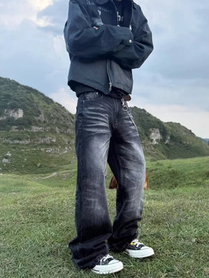 Belted dark grey wide-leg cotton jeans with pockets and a chain detail.