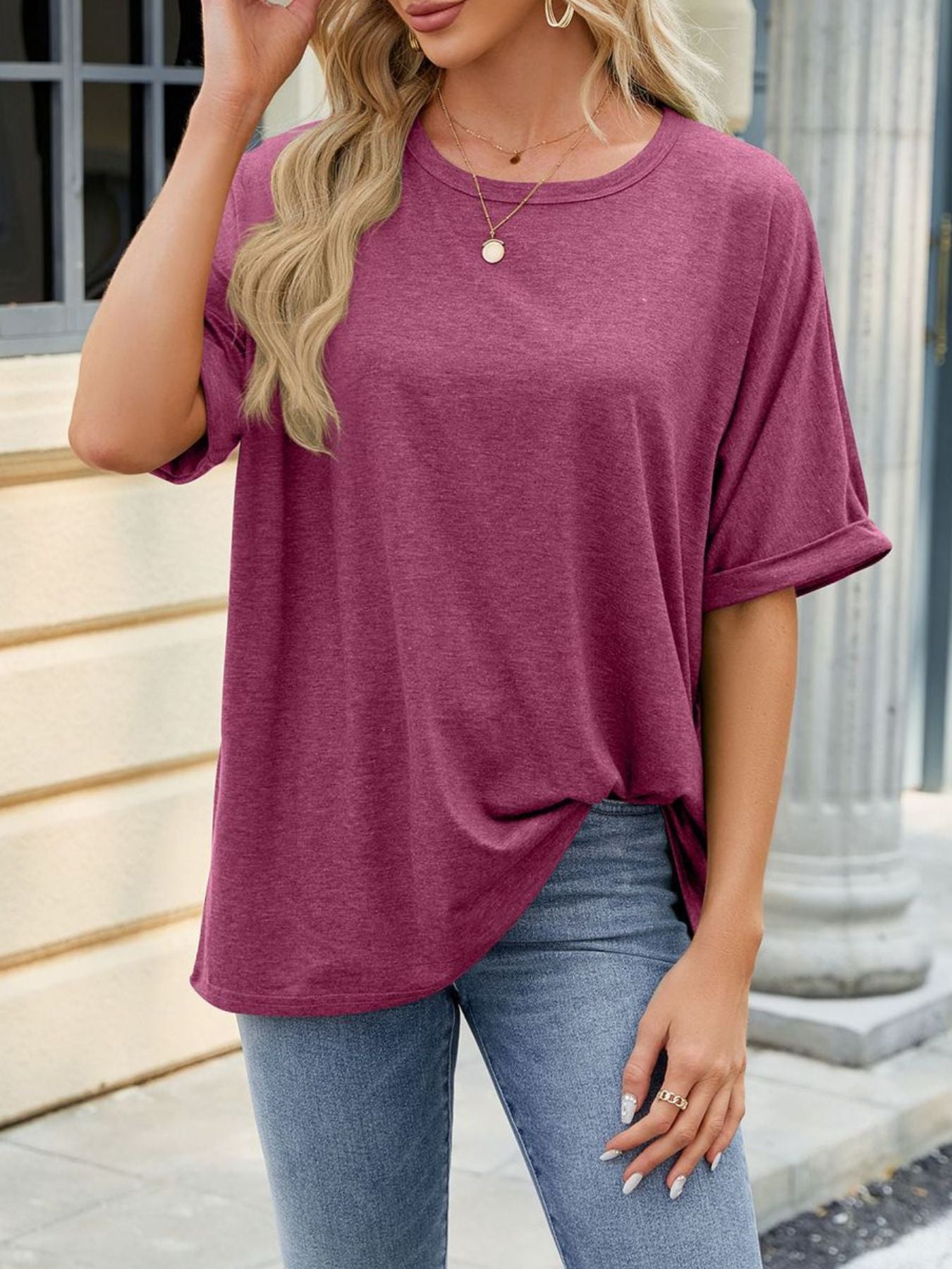 Relaxed fit crew neck t-shirt in deep purple with rolled short sleeves.